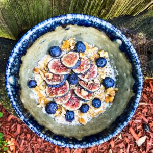 warm Oats with figs nuts and seeds and a peanut butter drizzle